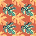 Seamless doodle green and orange monstera leaves silhouettes. Orange bright background