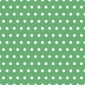 Seamless dotted pattern with white dots on green spring background color