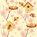 Seamless Easter background with birdhouses, birds and flowering branches Royalty Free Stock Photo