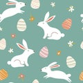 Seamless Easter pattern with cute white rabbits and decorated eggs. Spring floral design on green background. Great for Royalty Free Stock Photo