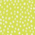 Seamless Easter pattern with eggs on green background. Vector.