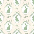 Seamless Easter pattern with green decorated eggs, bows and playful rabbits. Royalty Free Stock Photo