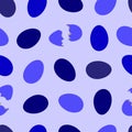 purple, blue, dark blue eggs whole and cracked in half on a light lilac background