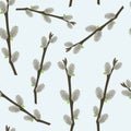 Seamless easter pattern with stylized willow branches on blue background.