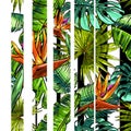 Seamless texture on the theme of the tropics, jungle from palm leaves, monstera, banana leaves, strelitzia and heliconia flowers.