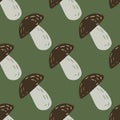 Seamless fall pattern with simple doodle mushroom silhouettes. Brown and grey colored ornament on green background