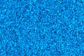 Seamless flat texture and background of blue toned granules of bee pollen