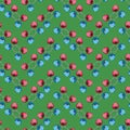 Seamless floral pattern of bright red and blue randomly arranged tulips, green background Royalty Free Stock Photo