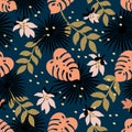 Seamless Floral Pattern. Fashion textile pattern with decorative tropical leaves and flowers on dark blue background Royalty Free Stock Photo