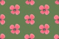 Seamless floral pattern with small delicate pink poppy flowers on vintage green background. Summer spring concept