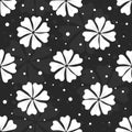 Seamless floral pattern with white flowers and dots on black background