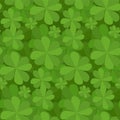 Seamless floral texture with a happy four-leaf clover.