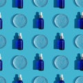 Seamless glass dropper bottles with pipettes and petri dishes on blue background.