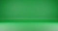Seamless Green Gradient Studio Background with Soft Lighting and Subtle Shadows Royalty Free Stock Photo