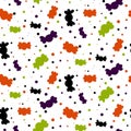 Seamless Halloween candy pattern. Bright candies, sweets, confetti in traditional Halloween colors on a white background Royalty Free Stock Photo