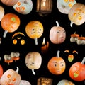 Seamless Halloween pattern, different pumpkins with toothy smiles on black background Royalty Free Stock Photo