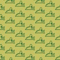 Seamless hand drawn animal green background pattern with green doodle cartoon baby crocodile for fabric design