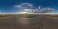 Seamless hdri 360 panorama view on asphalt road among fields in summer evening with awesome clouds in blue sky in equirectangular Royalty Free Stock Photo