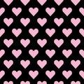 Seamless hearts pattern in pink over black. Valentine s day tile background