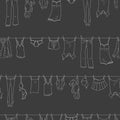 Seamless illustration on the theme of washing and cleanliness, various clothes , a light contour icons on dark background Royalty Free Stock Photo