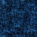 Seamless indigo block print texture on navy blue woven effect background. Japanese style washed denim batik resist