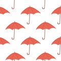 Seamless isolated pattern with doodle umbrella simple silhouettes. Red accessory on white background. Simple season print