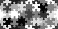 Seamless jigsaw puzzle pieces urban camouflage background pattern in black and white greyscale