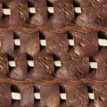 Seamless 4k photo texture material of brown worn leather pattern with rope insert and straps Royalty Free Stock Photo