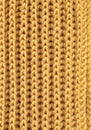 Seamless knitting wool texture pattern. Close-up view of abstract weaving textured fabric of yellow color. Warm cosy