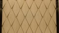 Seamless leather diamond shape pattern in beige color by craftmanship / seamless texture / abstract background material / handmade Royalty Free Stock Photo