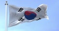 Seamless loop in slow motion of South Korea national flag waving on a clear day