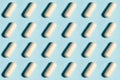 Seamless medical pill, pharmaceutical medicine capsule pattern. Painkiller, vitamin, antibiotic, probiotic on blue background