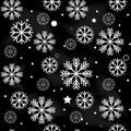 Seamless navy black background with snowflakes. Pattern snowfall with sparkling flares Royalty Free Stock Photo