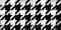 Seamless painted houndstooth black and white artistic acrylic paint texture background