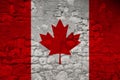 Seamless panorama of the national flag of the state of Canada on an old stone wall with cracks, the concept of historical, tourism