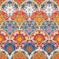 Seamless patchwork pattern with colorful mandalas. Decorative scales. Ethnic motifs