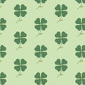 The seamless pattern with the abstract clover on the green background