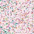 Abstract seamless pattern with colorful blue, yellow, orange, red, chaotic small circles on pink. Royalty Free Stock Photo