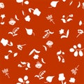 Seamless pattern of abstract contrasting floral elements on a red background for textiles.