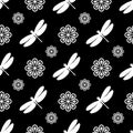 Seamless pattern with abstract flowers and dragonflies. White elements on a black background. Vector illustration Royalty Free Stock Photo