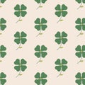 The seamless pattern with the abstract green clover on the beige background Royalty Free Stock Photo