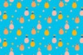 Seamless pattern of abstract multi-colored whole pineapples and their slices in doodle style on a bright blue background. Contempo