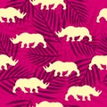 Seamless pattern with african rhino and palm leaves.