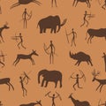 Seamless pattern. Ancient rock paintings show primitive people hunting on animals. The Paleolithic era. Royalty Free Stock Photo