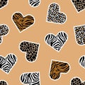 Seamless pattern of animal skin in shape of heart: leopard, giraffe, tiger and zebra. Royalty Free Stock Photo