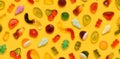 Seamless pattern of assorted jelly gum fruit candy on yellow background Royalty Free Stock Photo