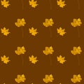 Seamless pattern with autumn yellow leaves on brown color