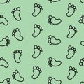 Seamless Pattern of Baby Footprints on Mint Green Background Royalty Free Stock Photo