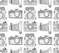 Seamless pattern background with hand drawn ornamental retro cameras.