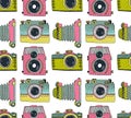 Seamless pattern background with hand drawn ornamental retro cameras.